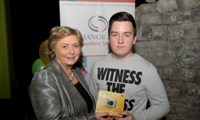 Minister Fitzgerald presents Martin McDonagh with a raffle prize of a digital camera
